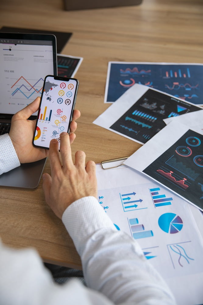 office workers using finance graphs 1